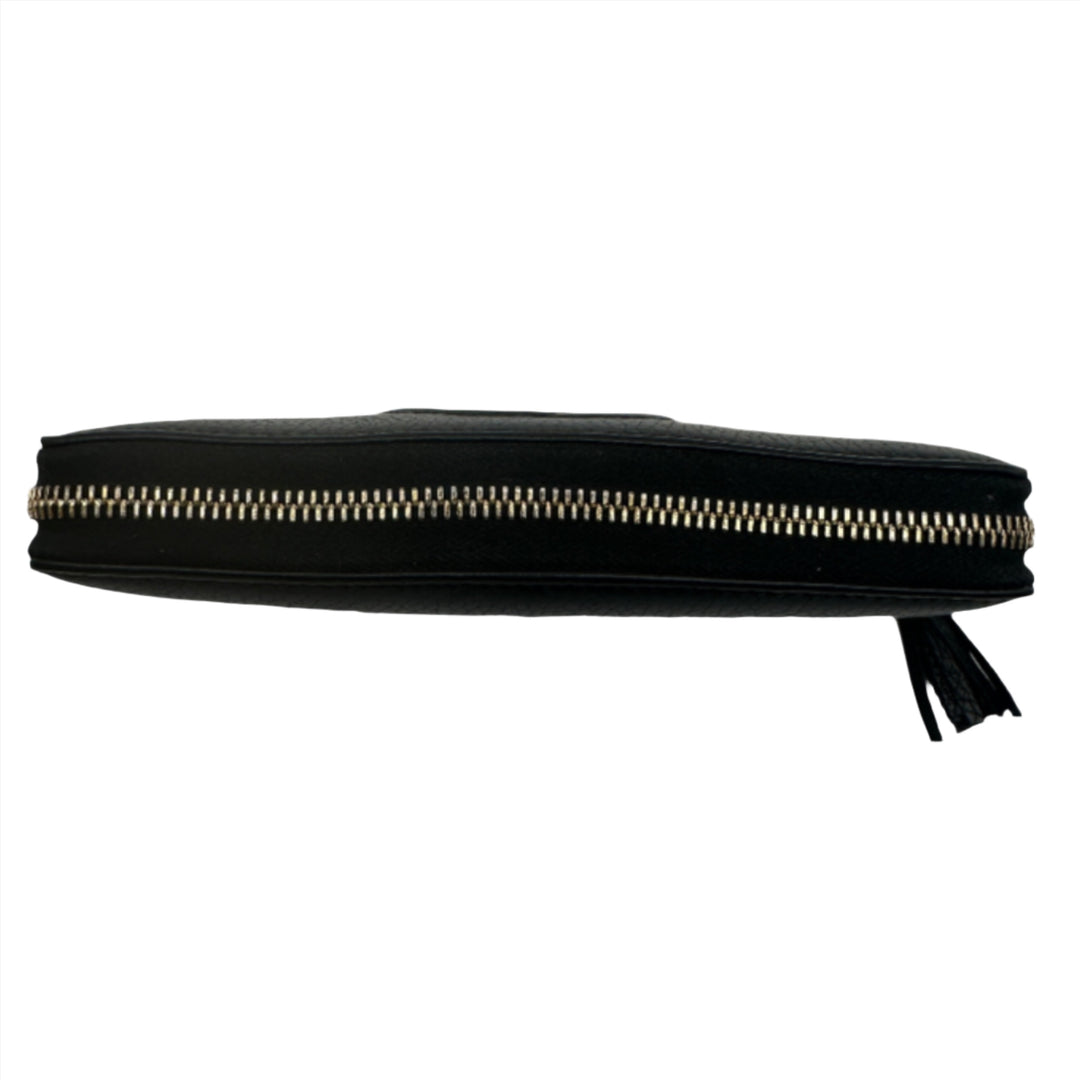 Black GUCCI Pebbled Calfskin Soho Zip Around Wallet showcasing gold zipper from top view.