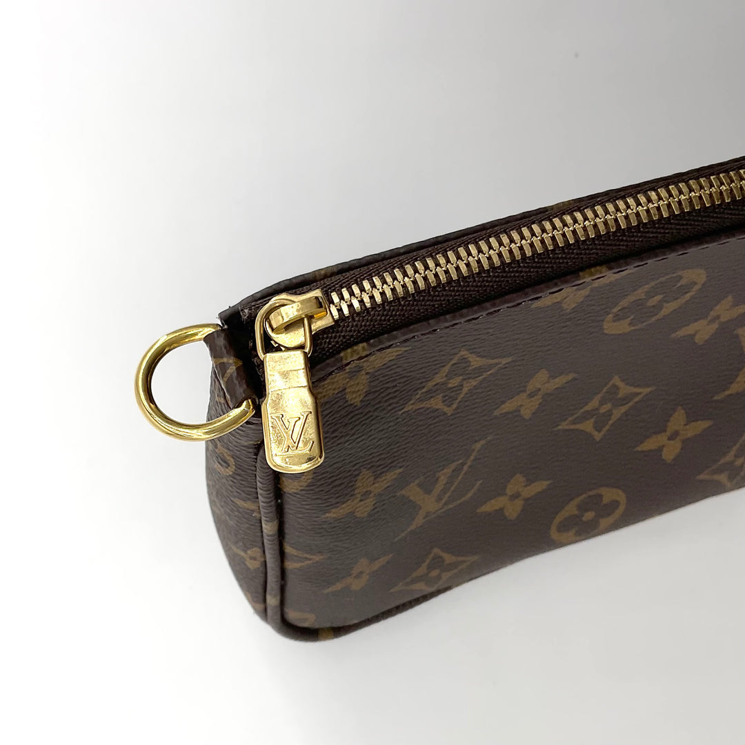 Close-up of LOUIS VUITTON Monogram Multi Pochette Large with gold zipper and LV logo on brown monogram canvas.