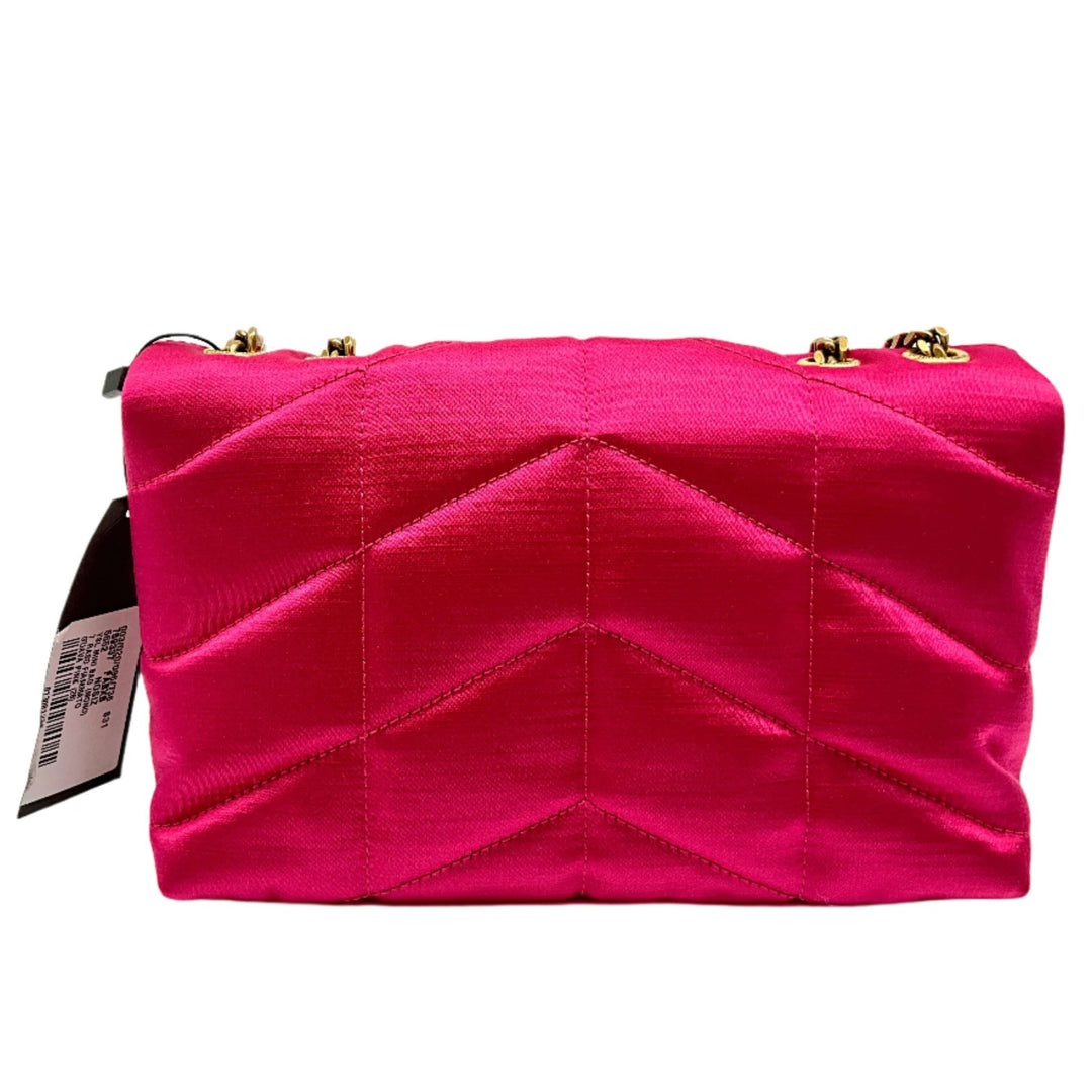 Vibrant pink quilted pouch with sleek gold hardware, featuring a bold geometric design, perfect for stylish accessory organization.