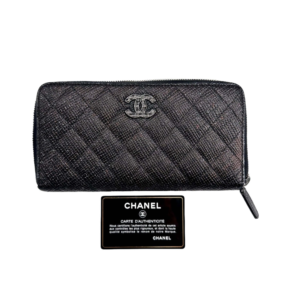 Chanel Glittered Calfskin Quilted Large Gusset Zip Wallet in Black with authenticity card displayed underneath.