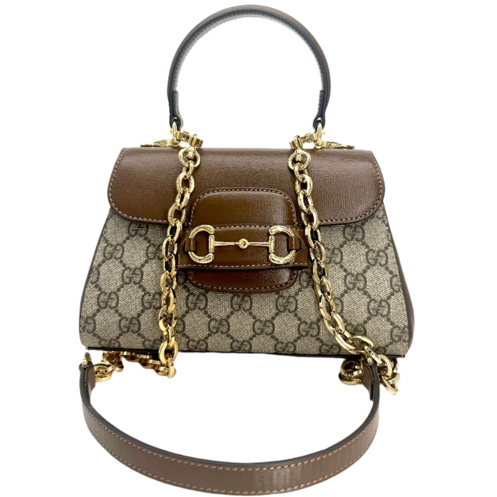 GUCCI Horsebit 1955 Mini Bag in brown and beige, featuring signature GG canvas, leather trim, gold chain strap, and horsebit hardware.