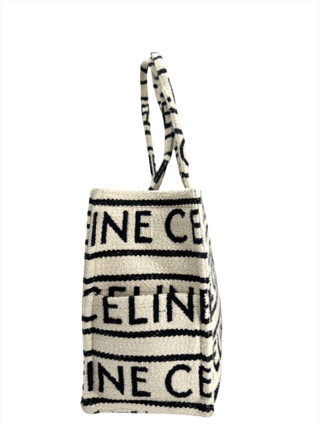 Side view of CELINE Canvas Large All Over Cabas Thais tote with black logo pattern.