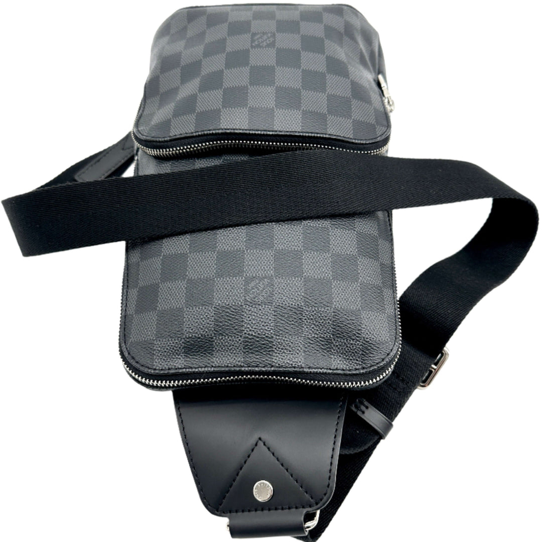 Authentic LOUIS VUITTON Damier Graphite Avenue Sling Backpack front view showing adjustable black strap