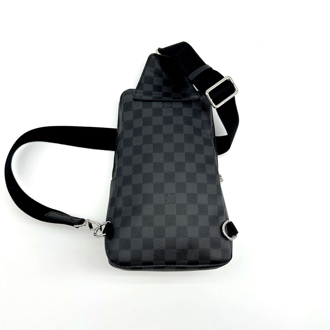 Authentic LOUIS VUITTON Damier Graphite Avenue Sling Backpack back view with adjustable black strap