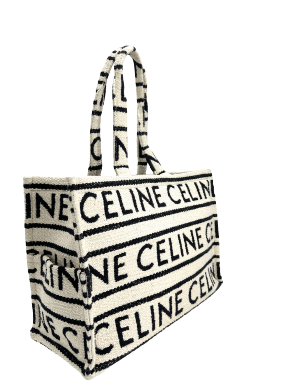 CELINE Canvas Large All Over Cabas Thais bag with black and white striped design featuring the brand's name.