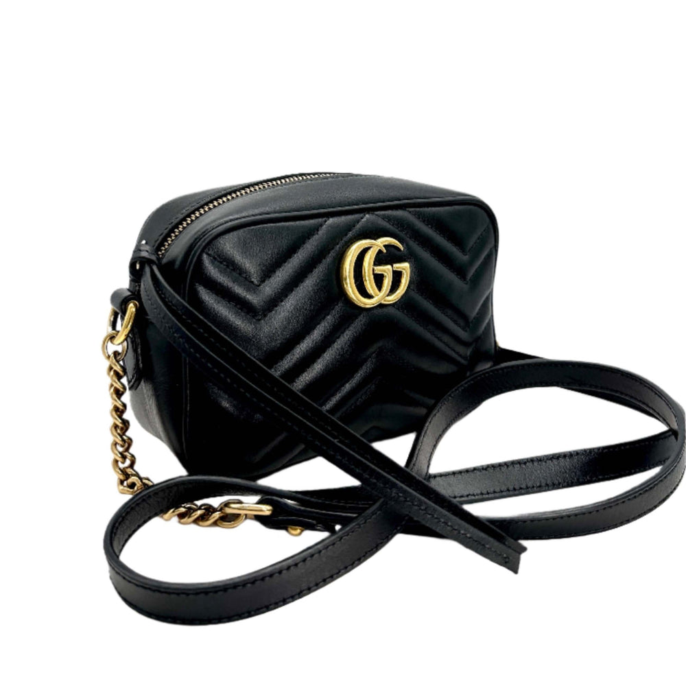 GUCCI GG Marmont Matelassé Mini Bag in black leather with gold hardware and chain strap.