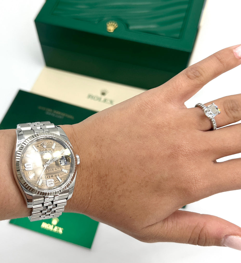 Wearing Rolex Datejust 36 with bronze waves diamond dial, fluted bezel, and Jubilee bracelet on wrist, green Rolex box in background.