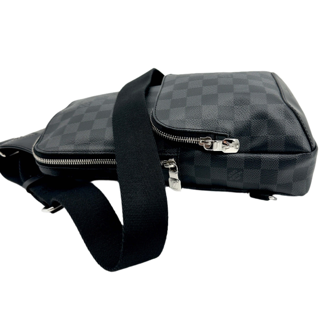 Authentic LOUIS VUITTON Damier Graphite Avenue Sling Backpack side view with black adjustable strap