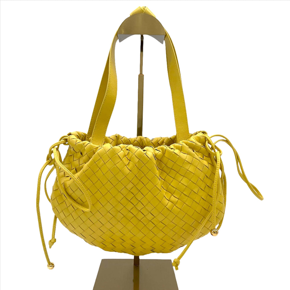 Bottega Veneta Bulb Small Intrecciato Yellow Shoulder Bag on display stand