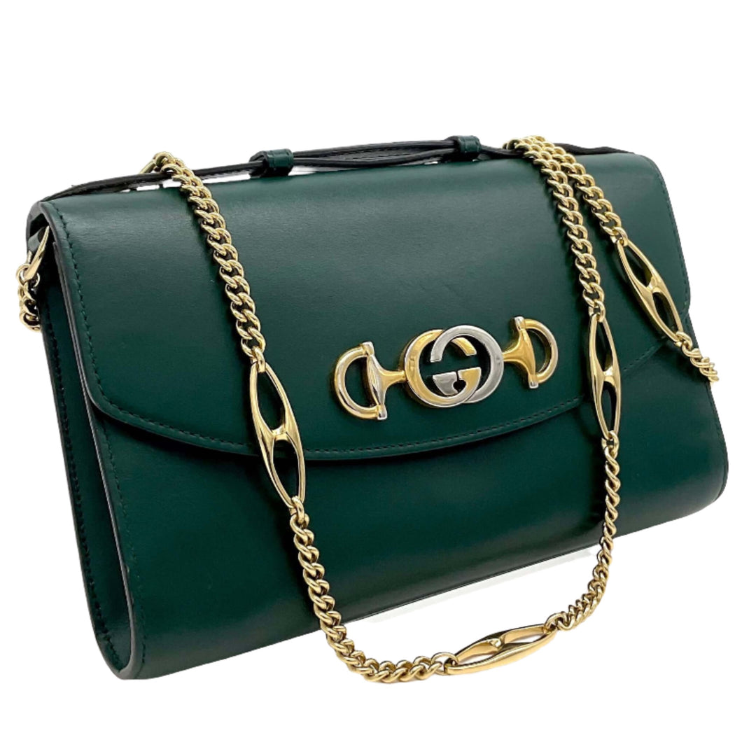 Gucci Zumi Smooth Leather Small Shoulder Bag in elegant dark green with gold chain straps and iconic Gucci logo.