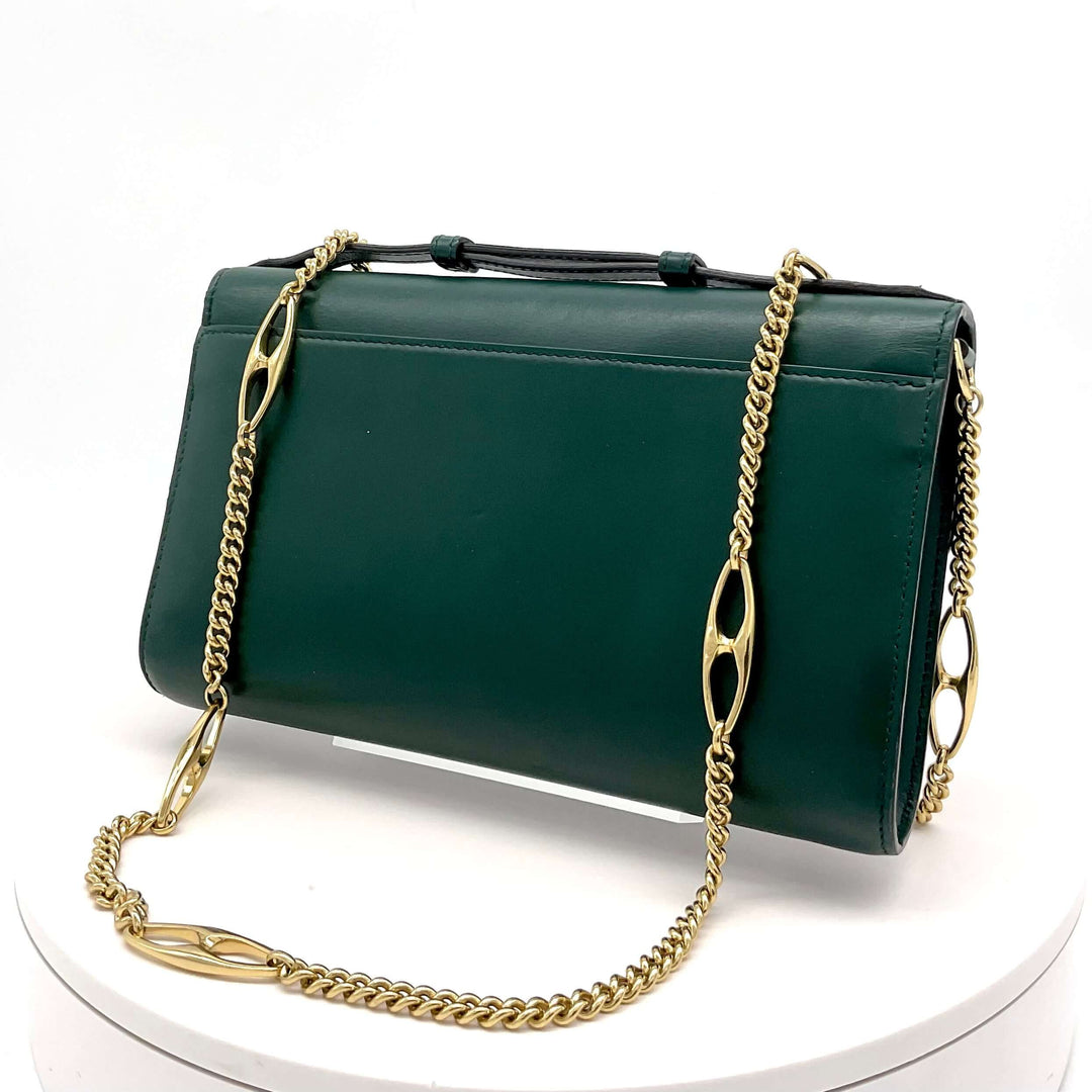 Green Gucci Zumi Smooth Leather Small Shoulder Bag with Gold Chain Strap on Display Table