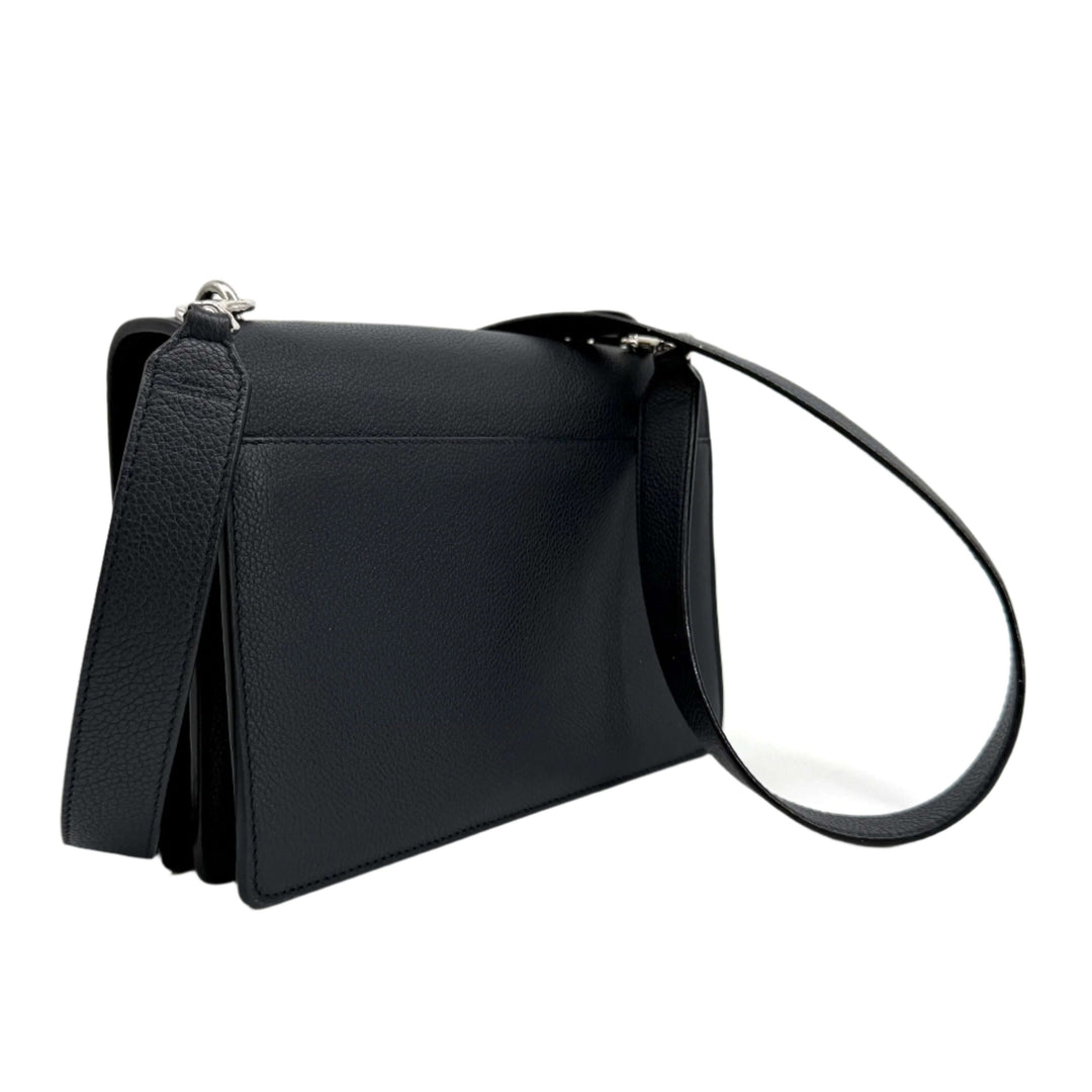 Authentic black grained calfskin bag with a structured silhouette and a shoulder strap. Perfect for chic, everyday use.