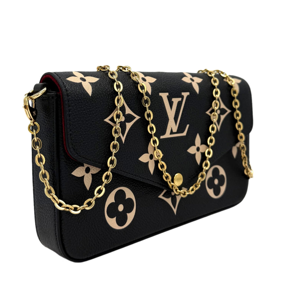 Authentic Louis Vuitton Empreinte Monogram Giant Felicie Pochette in Black and Beige with gold chain. Elegant and stylish accessory.