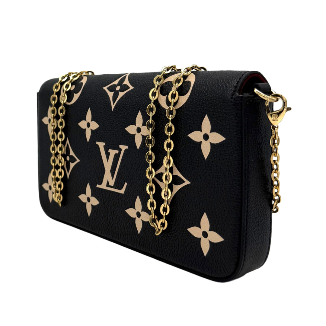 Authentic Louis Vuitton Empreinte Monogram Giant Felicie Pochette in black with beige accents and gold chain straps.