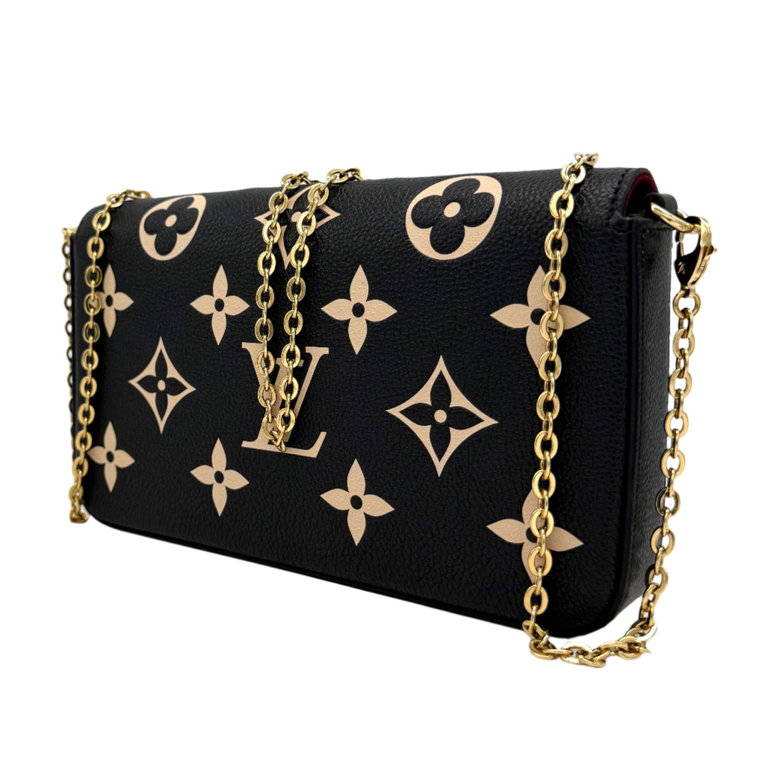 Authentic Louis Vuitton Empreinte Monogram Giant Felicie Pochette in Black and Beige with gold chain detail.