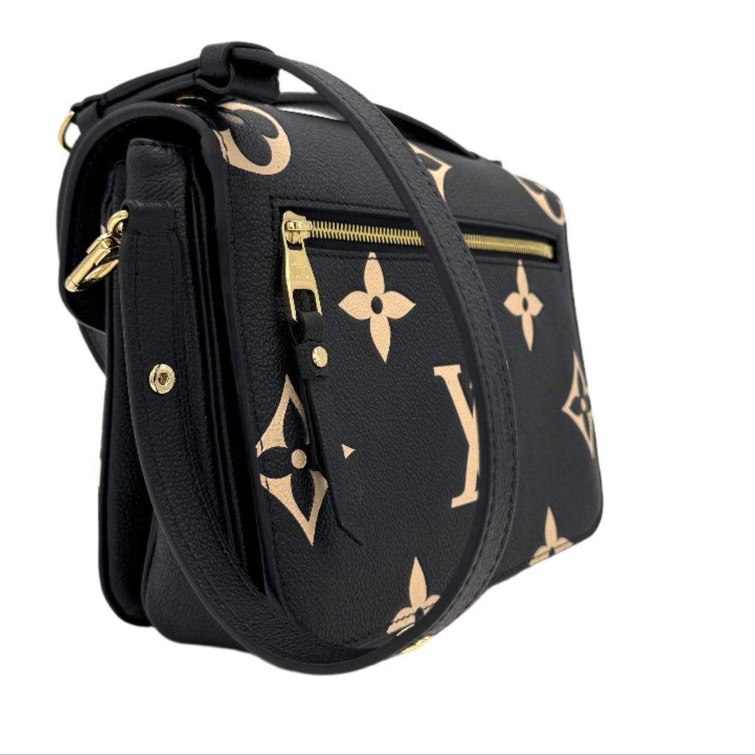 Authentic Louis Vuitton Empreinte Monogram Giant Pochette Metis in black and beige, showcasing oversized monogram design and crossbody strap.