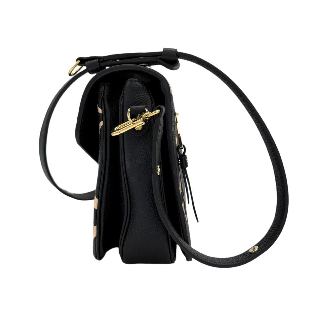 Side view of the Authentic Louis Vuitton Empreinte Monogram Giant Pochette Metis in Black and Beige showcasing its elegant design.