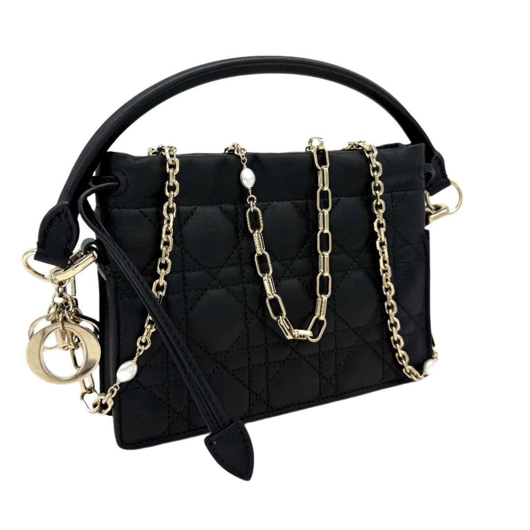 Authentic Christian Dior Black Lambskin Cannage Mini Top Handle Drawstring Bag with chain and 'D.I.O.R.' charm.