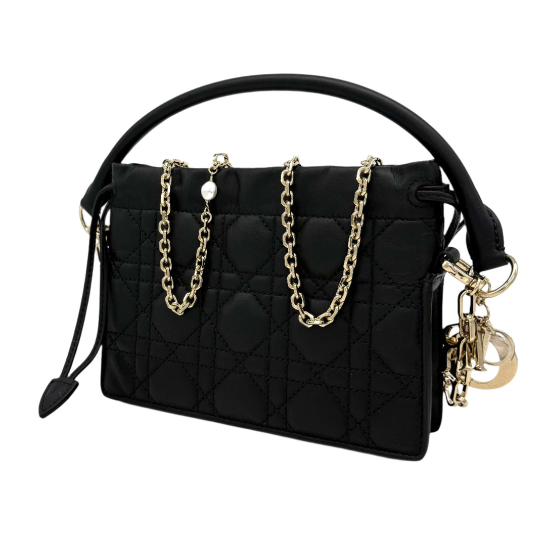 Authentic Christian Dior black lambskin Cannage mini top handle drawstring bag with gold chain accents.