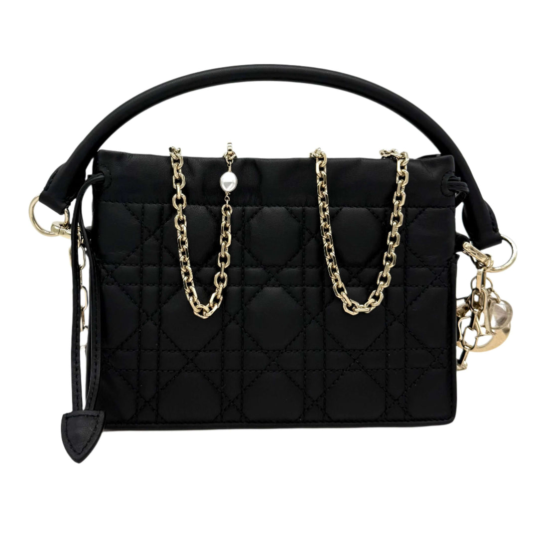 Authentic Christian Dior black lambskin Cannage mini top handle drawstring bag with gold chain accents.