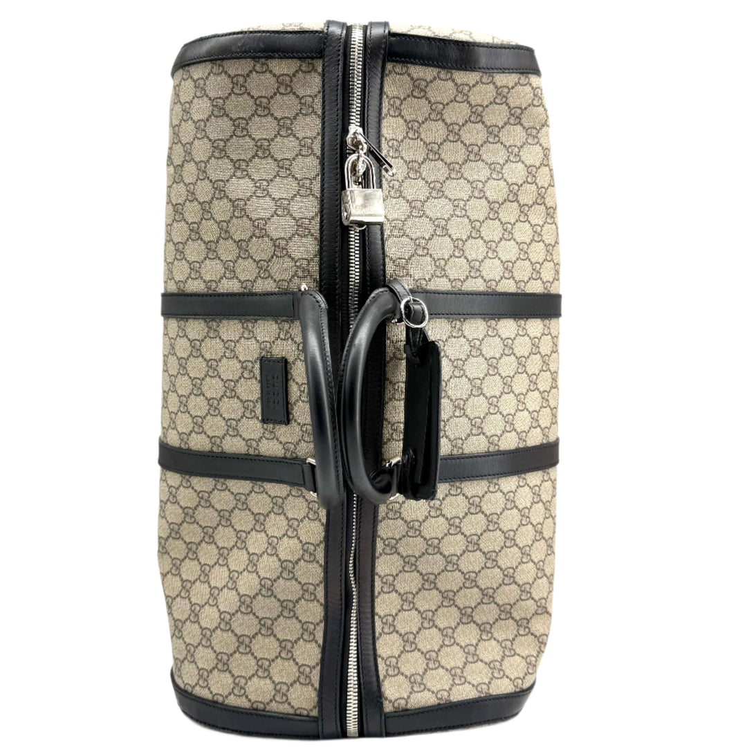 Authentic Gucci GG Supreme Duffle Carry-on Bag in beige canvas with black leather details.