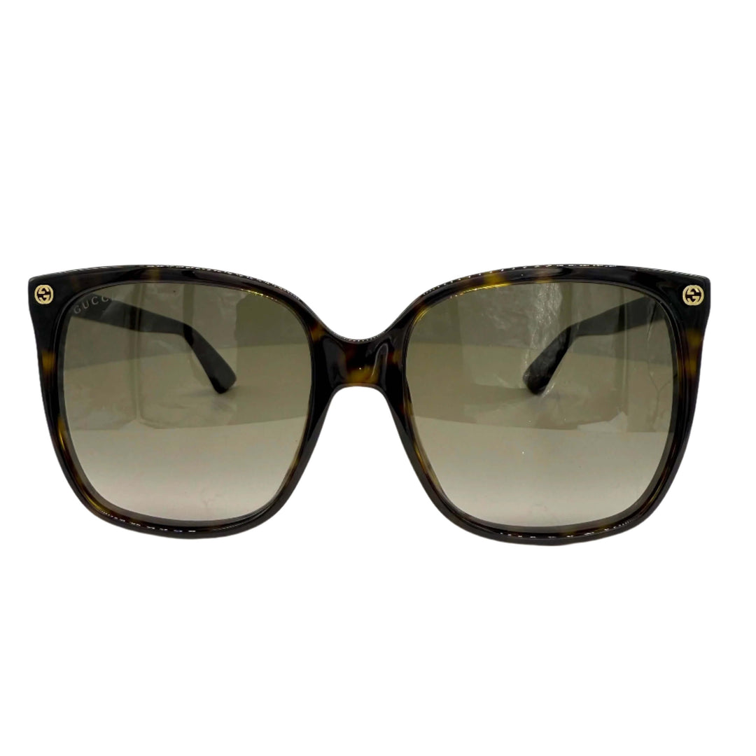 Authentic Gucci GG0022S cat eye sunglasses in havana with brown lenses, showcasing a stylish and elegant design.