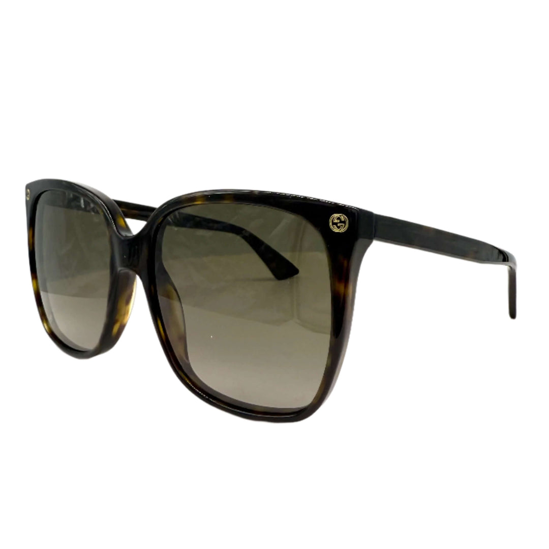 Authentic Gucci GG0022S cat eye sunglasses in havana with brown lenses for women, offering stylish protection and elegance.