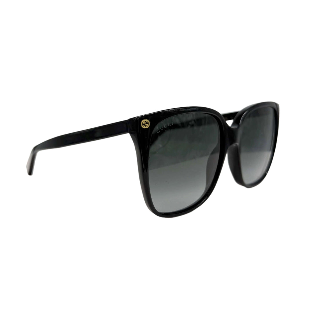 Authentic Gucci GG0022S cat eye sunglasses in black with grey lenses, stylish and elegant accessory for women.