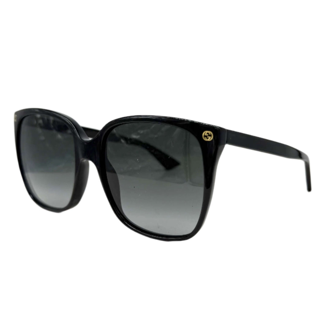 Authentic Gucci GG0022S cat eye sunglasses in black with grey lenses, showcasing elegant design and stylish appeal.