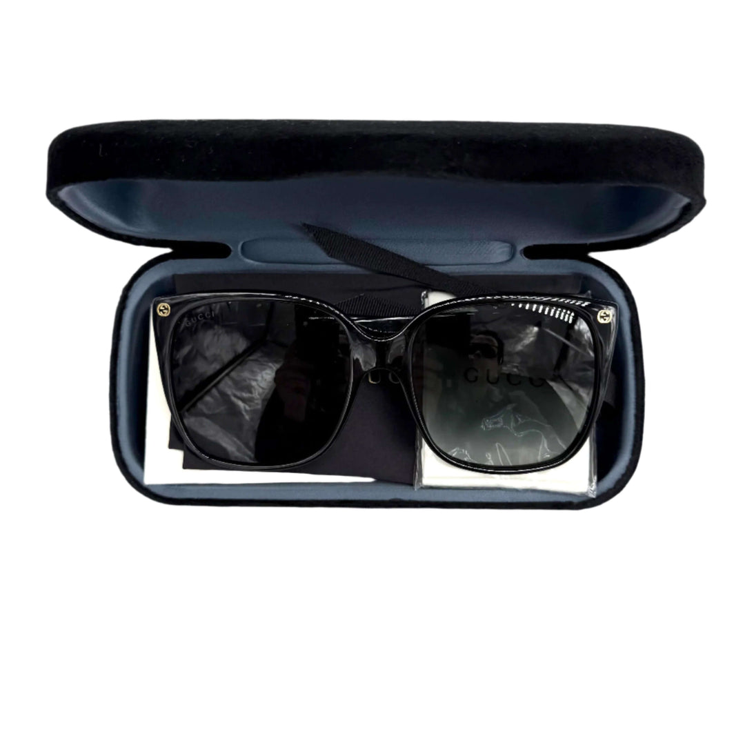 Authentic Gucci GG0022S Cat Eye Sunglasses in a sleek case with grey lenses, exuding luxury and modern elegance.