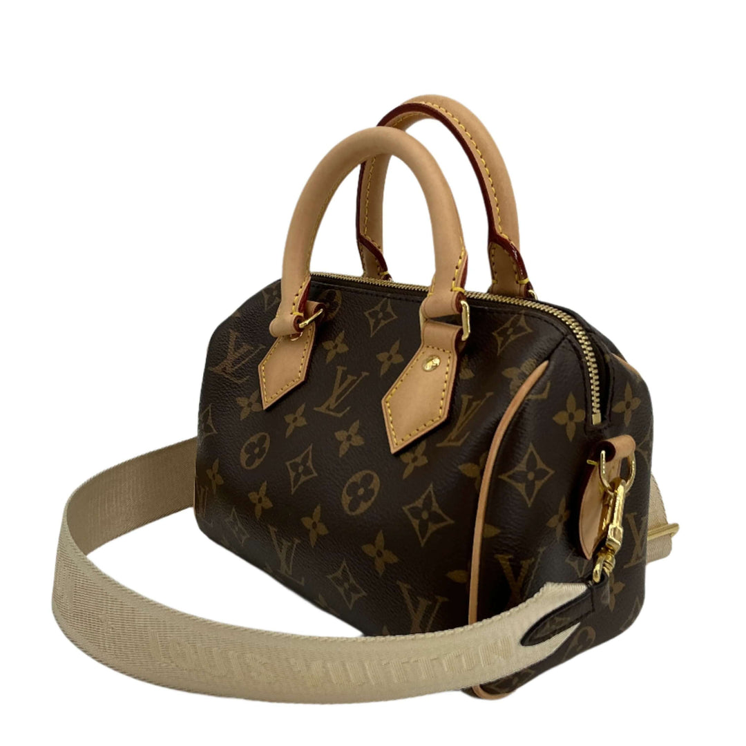 Luxury Louis Vuitton bag with beige Jacquard strap and classic monogram print