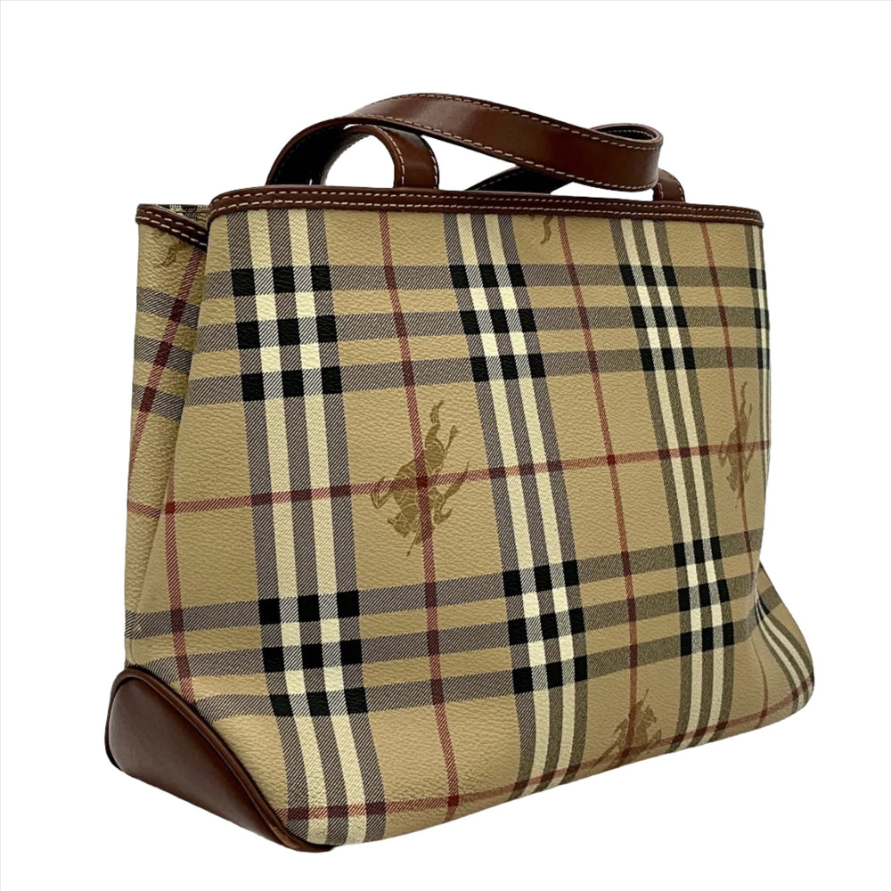 Vintage Burberry shoulder bag with signature beige plaid pattern and brown leather handles.