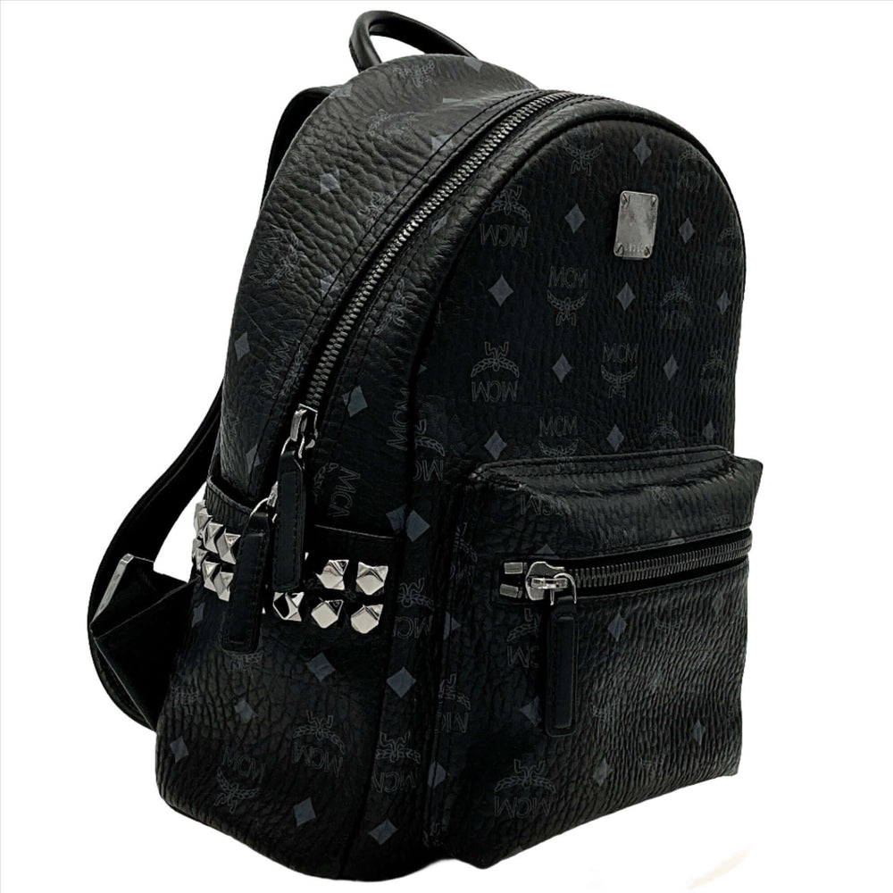 MCM Stark Side Studs Backpack in black Visetos with front zippered pocket and signature studs detailing.