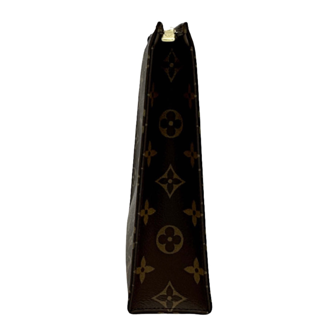 Side view of LOUIS VUITTON Monogram Toiletry Pouch 26, showcasing its sleek design and iconic monogram pattern.