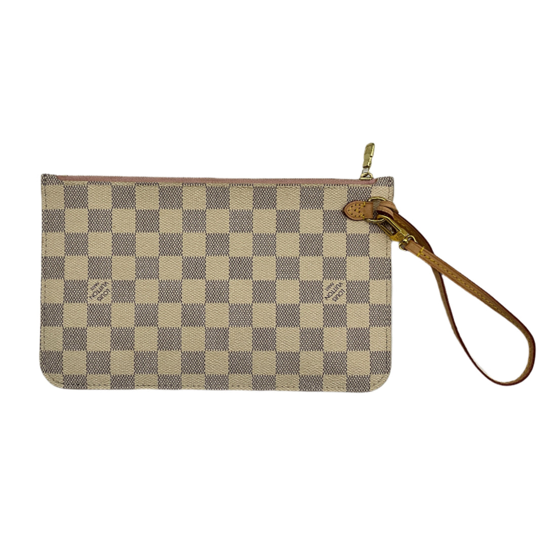Louis Vuitton DA wristlet with cream and beige interior, featuring checkered pattern and leather strap.