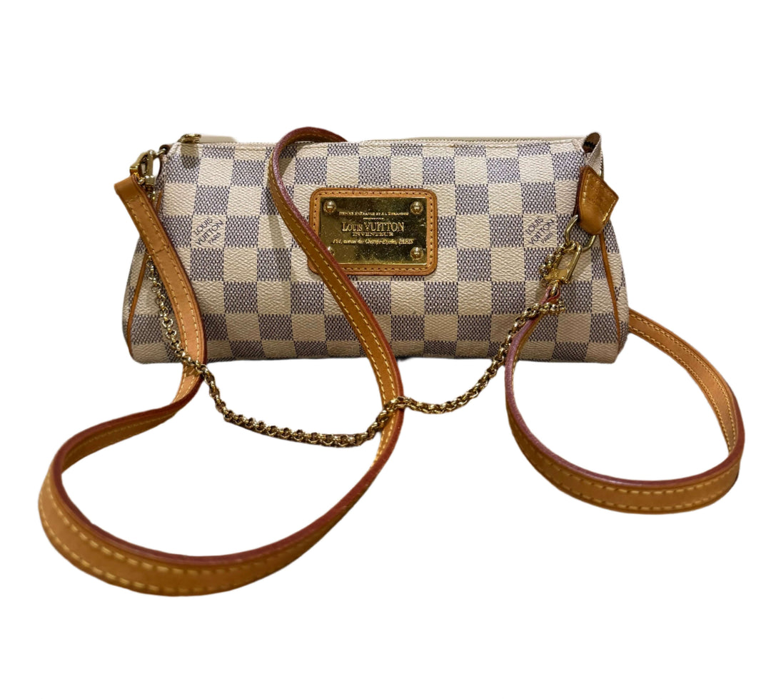 Authentic Louis Vuitton Damier Azur Eva Clutch with vachetta leather trim and chain strap, showcasing effortless elegance.