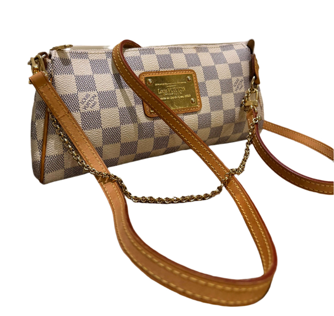 Authentic Louis Vuitton Damier Azur Eva Clutch with chain and leather strap, showcasing timeless elegance and versatile design.