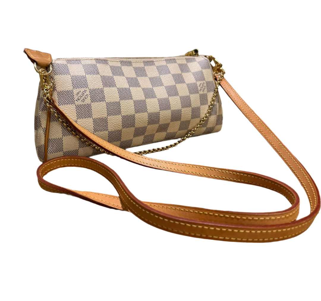 Elegant Louis Vuitton Damier Azur Eva Clutch showcasing iconic checker pattern and natural vachetta leather accents.