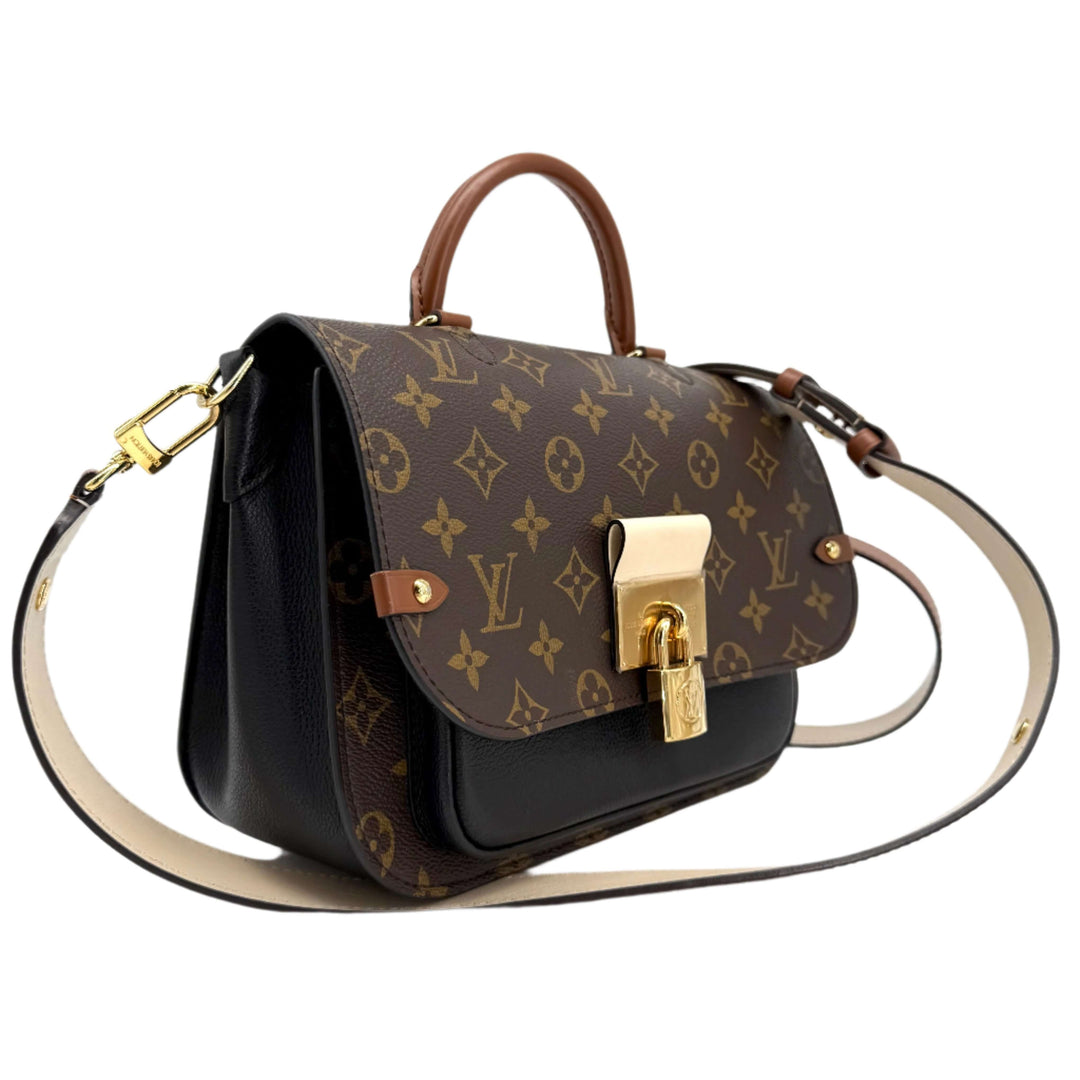 Authentic Louis Vuitton Monogram Vaugirard bag in black with gold lock and brown accents, showcasing modern luxury and elegance.