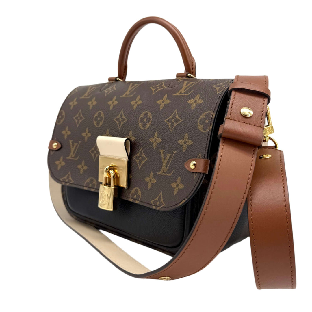 Authentic Louis Vuitton Monogram Vaugirard in Black with gold hardware and brown leather accents, showcasing timeless elegance.