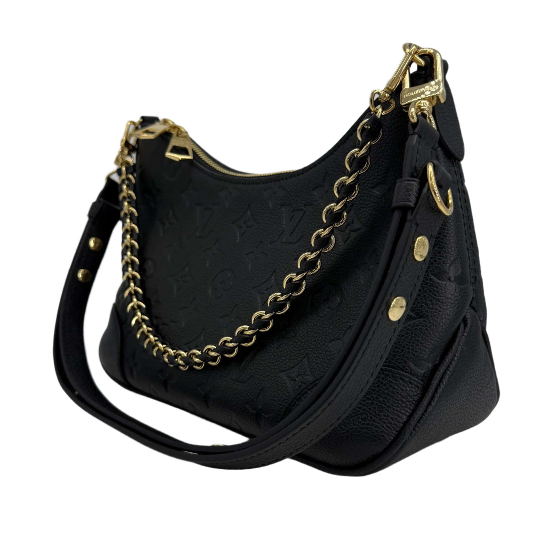 Louis Vuitton Boulogne Bag in black Monogram Empreinte leather with gold-toned hardware and chain strap.