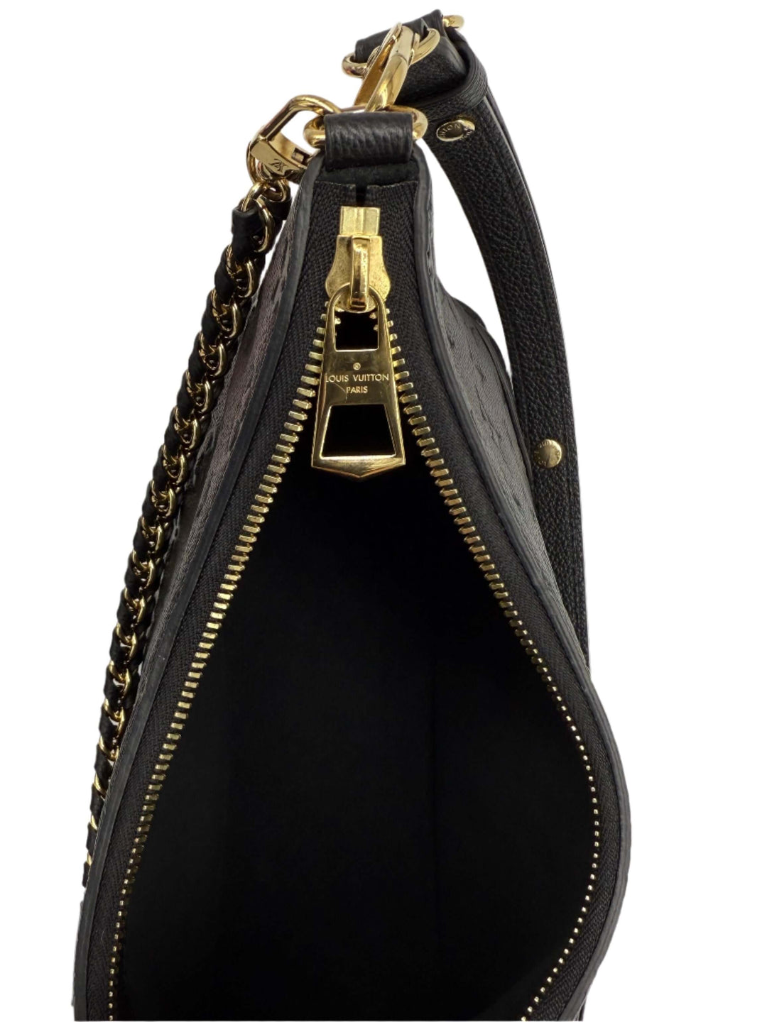 Interior view of Louis Vuitton Boulogne Bag showcasing black leather and gold-toned zipper details.