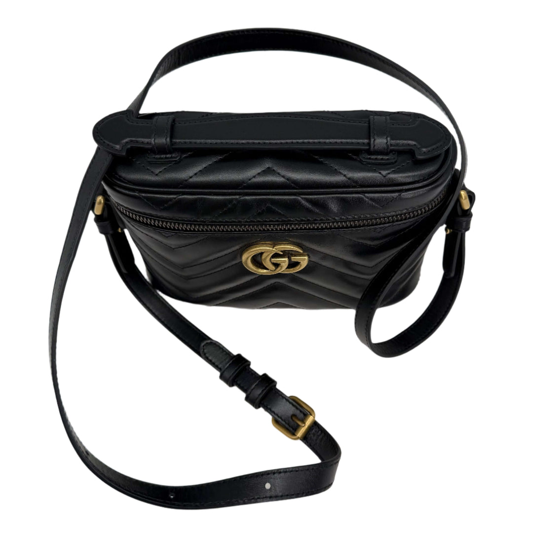 Gucci Mini GG Marmont Round Backpack in black calfskin with chevron quilted design and gold GG logo hardware.