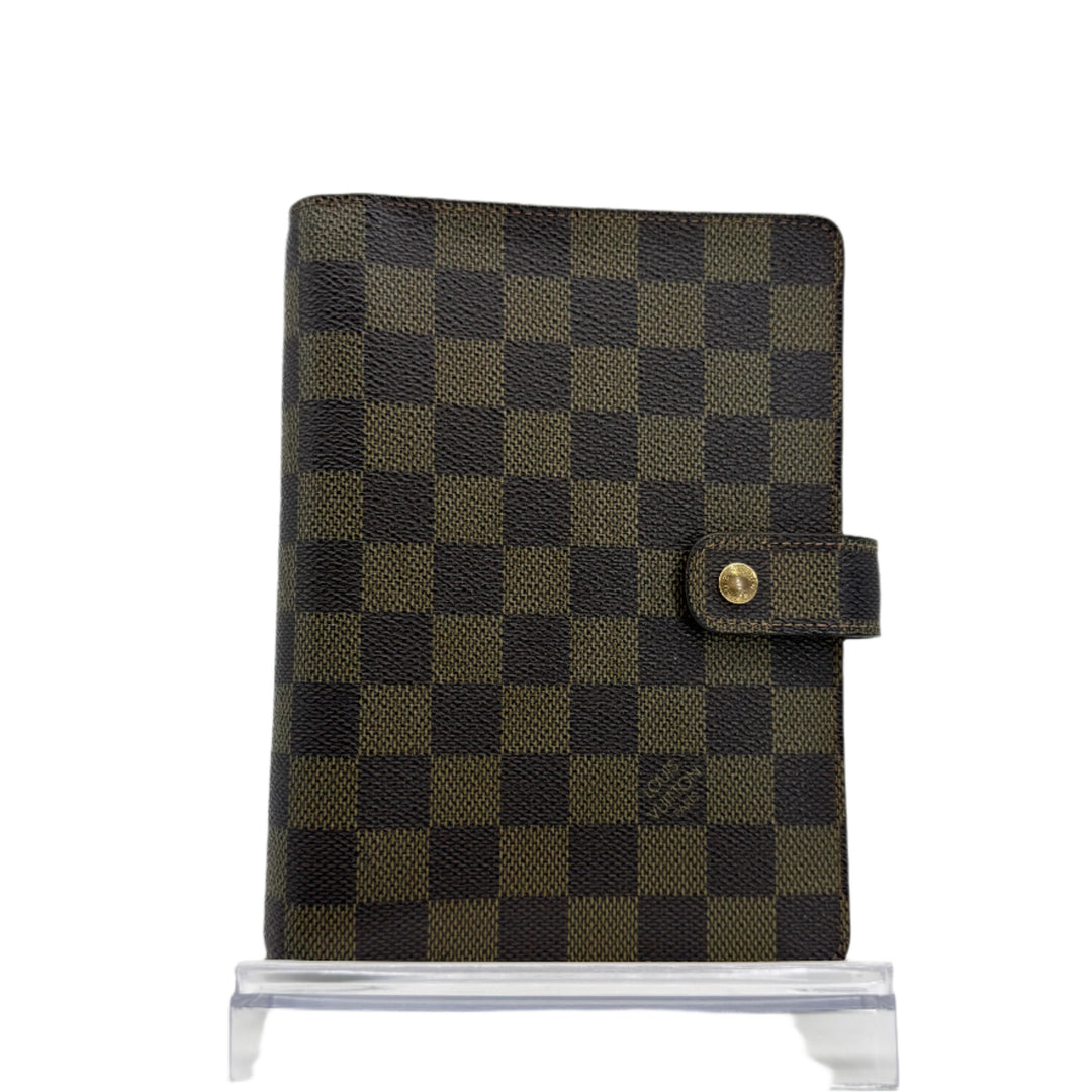 Louis Vuitton Damier Ebene Medium Ring Agenda Cover, authentic pre-owned leather organizer with checkered pattern.