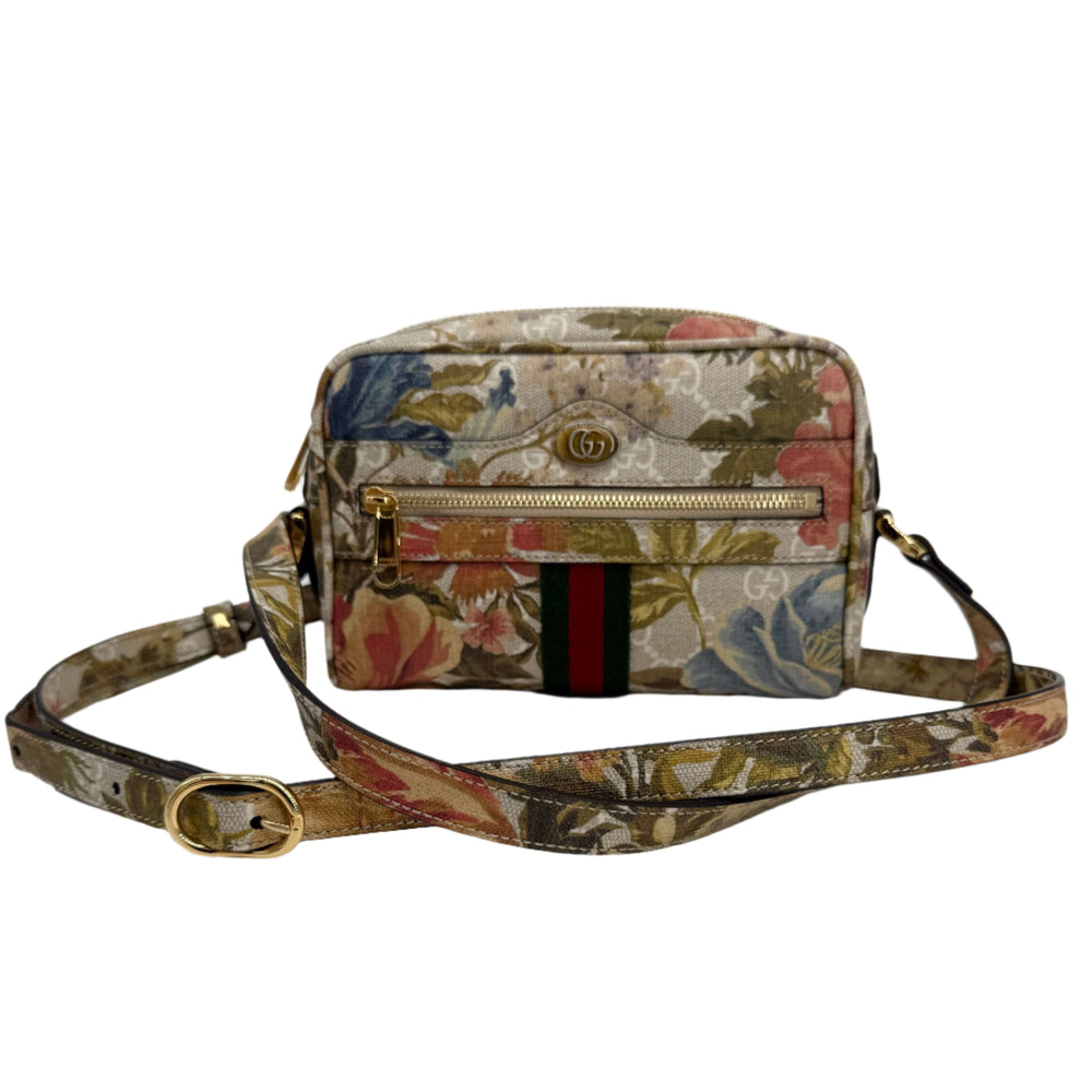 Gucci floral print handbag with adjustable strap and signature striped detail.