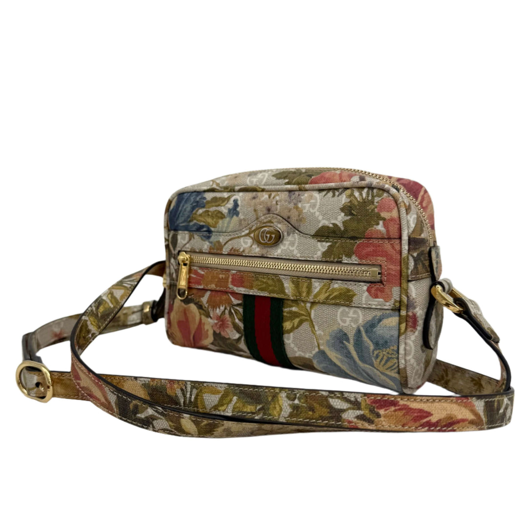 Gucci floral print shoulder bag featuring a zippered pocket and adjustable strap, perfect for chic everyday use.