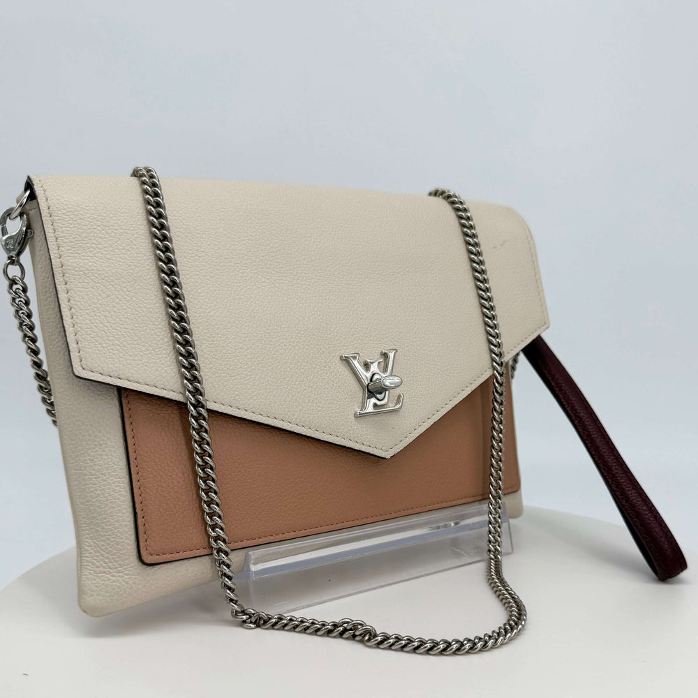 Authentic Louis Vuitton My Lockme Pochette in soft calfskin with rose silk, quartz accents, and silver-tone chain strap.