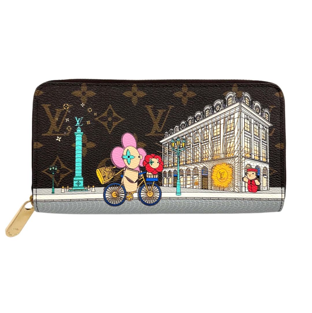 Authentic Louis Vuitton Monogram 2022 Christmas Animation Paris Zippy Wallet in Pink featuring festive city scene and characters.