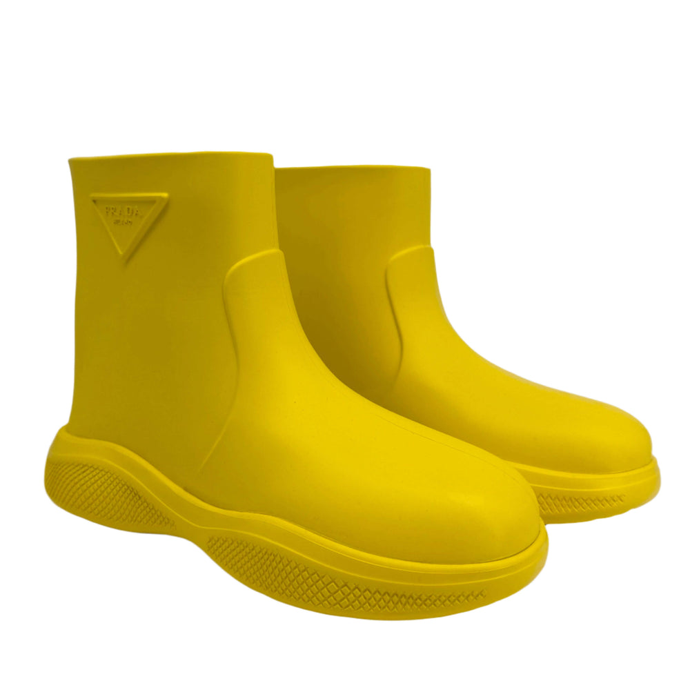 Prada Yellow Rubber Rain Boots in size 35, featuring slip-resistant soles and iconic branding, authentic pre-owned.