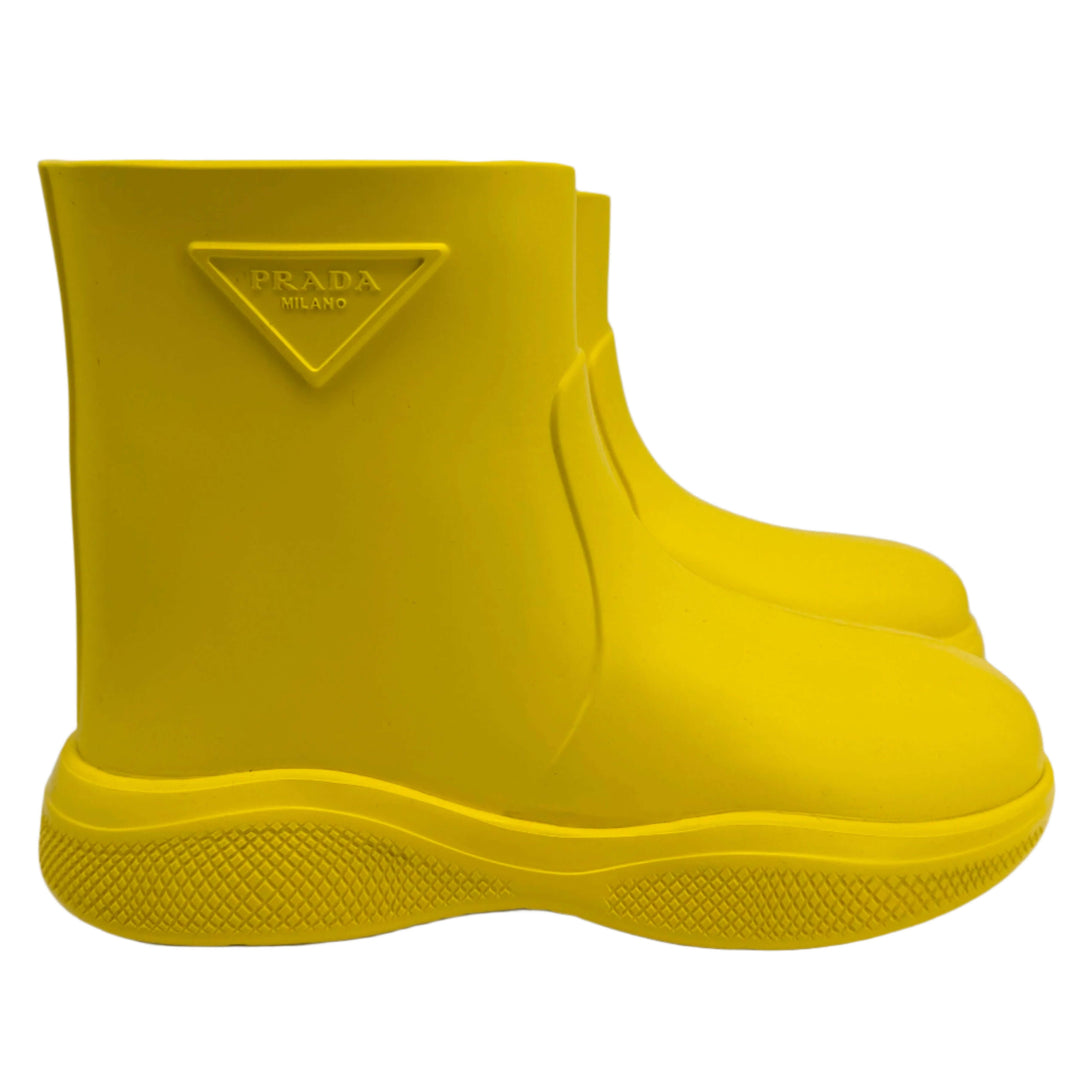 Prada Yellow Rubber Rain Boots in size 35, featuring slip-resistant soles and iconic branding, perfect for rainy days.